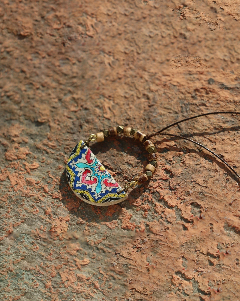 Gardoon Semicircle Tile Necklace – lifestyle, hand-cut air-dried Persian tile
