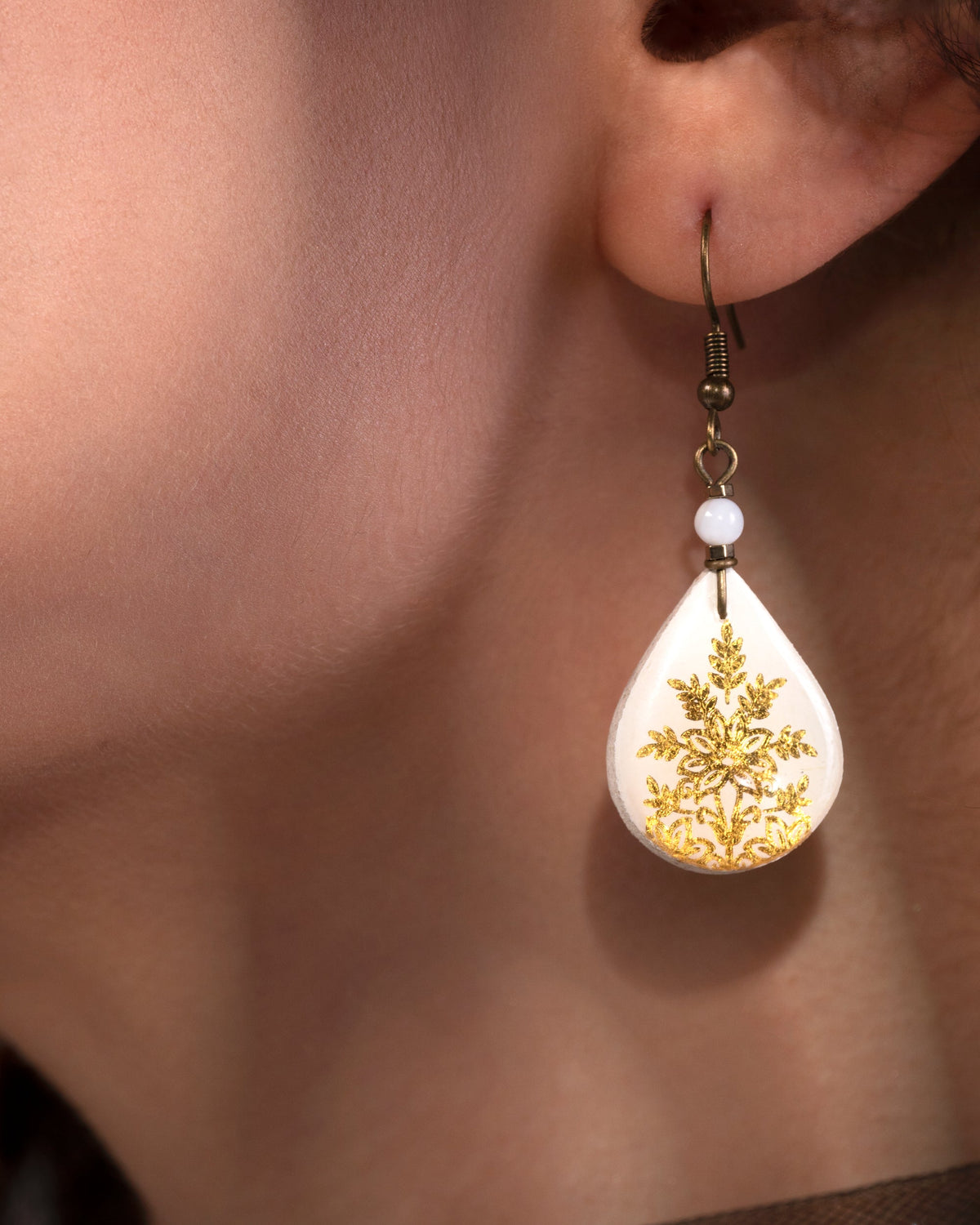 Zarrin Teardrop Tile Earrings, Snowflake – worn, in scale, hand-cut air-dried Persian tile